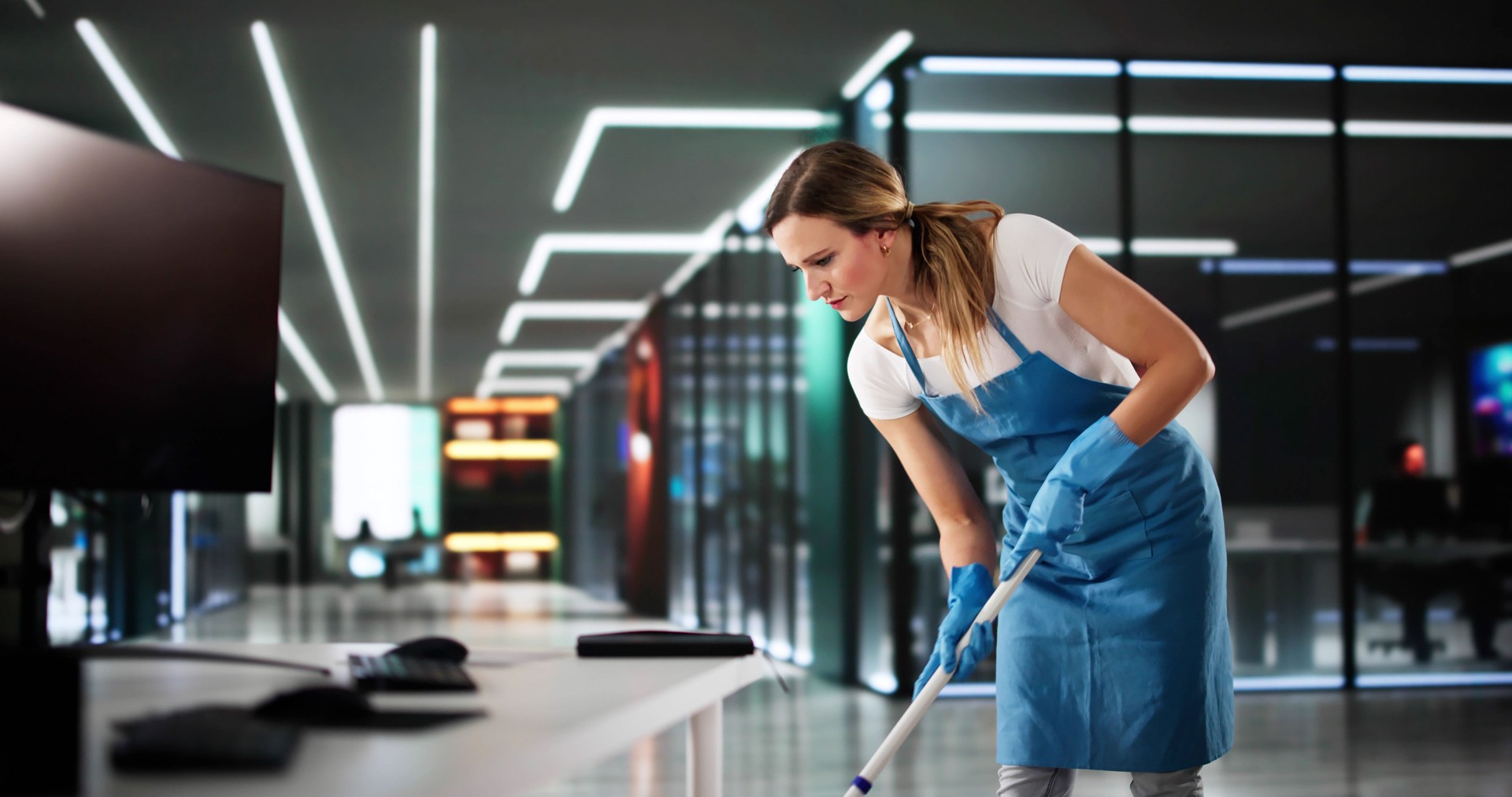 Professional Cleaner At Hotel Uses Mop